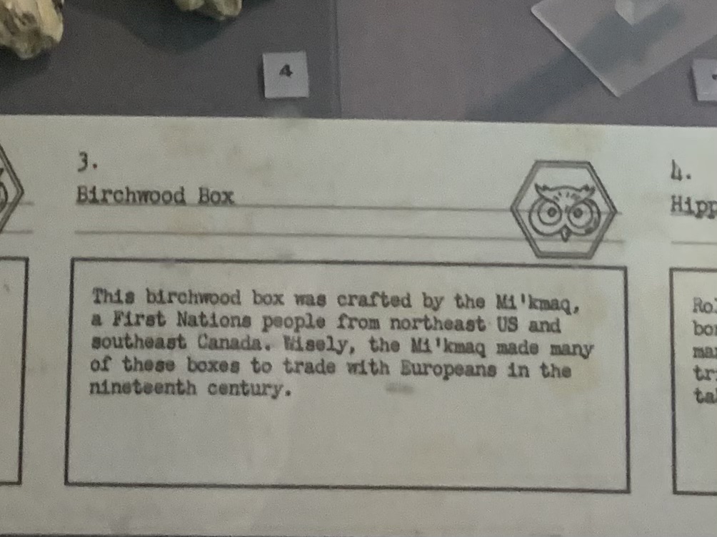 Museum label that reads: 3. Birchwood Box. This birchwood box was crafted by the Mi'kmaq, a First Nations people from the northeast US and southeast Canada. Wisely, the Mi'kmaq made many of these boxes to trade with Europeans in the nineteenth century.'